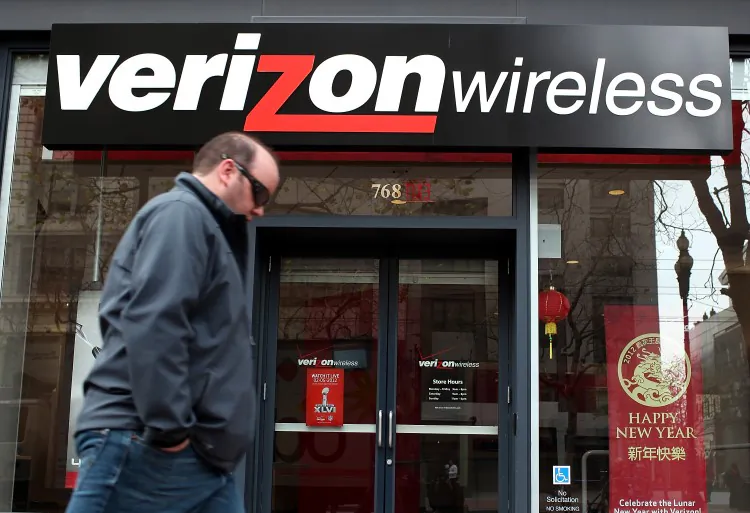 A pedestrian walks by a Verizon Wireless store on January 24, 2012 in San Francisco, California. (Justin Sullivan/Getty Images)