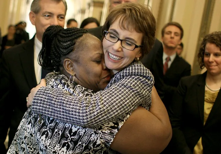 Rep. Gabrielle Giffords (D-AZ) gets a hug from House Cloak Room attendant Ella Terry, after she resigned from the House of Representatives, on January 25, 2012 in Washington, DC. (Mark Wilson/Getty Images)