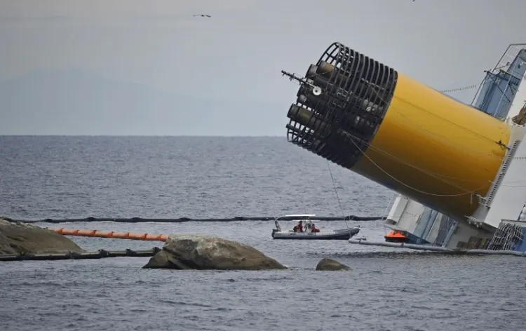 Rescuers work near the cruise liner Costa Concordia liying aground in front of the Isola del Giglio (Giglio island) on January 27, 2012 (Filippo Monteforte/AFP/Getty Images)