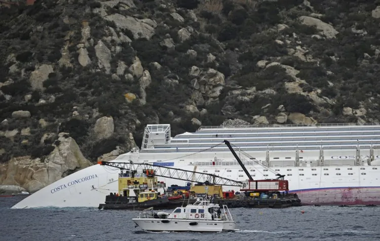 Technicians work near the stricken Costa Concordia cruise ship near Giglio island on January 27, 2012. (Filippo Monteforte/AFP/Getty Images}