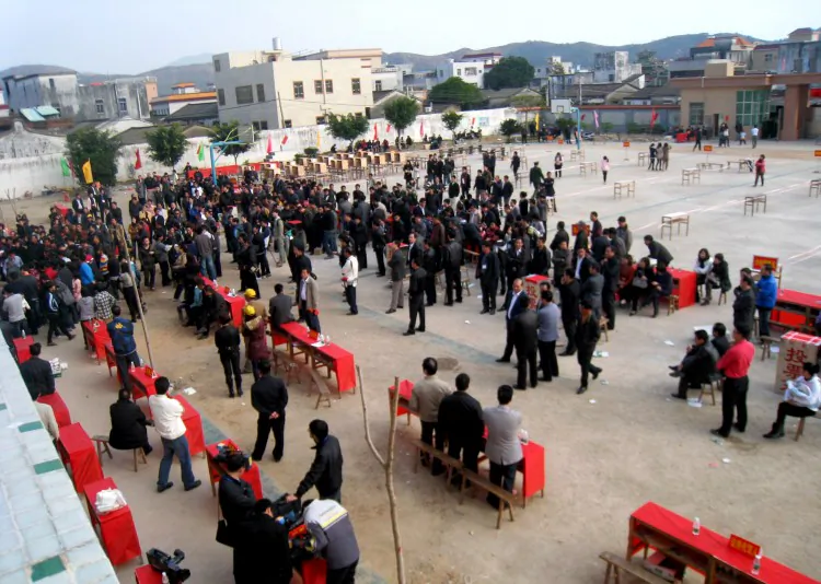 Wukan residents cast ballots on Feb. 1 in an election process that appears to be subject to arbitrary changes in rules by local Party officials. (STR/AFP/Getty Images)