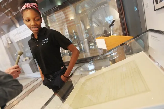 African-American student Naya Rogers, 13, is interviewed next to a rare handwritten copy of the Thirteenth Amendment which abolished slavery after it was unveiled at the New York Historical Society on February 1, 2012 in New York City. The document, signed by Abraham Lincoln, was unveiled to coincide with Black History Month and will be on display until April 1. (Mario Tama/Getty Images)