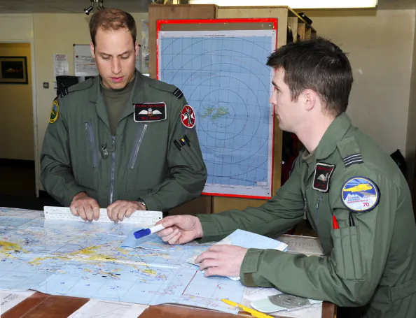 In this handout image provided by the Ministry of Defence, Prince William, Duke of Cambridge (L) and his crew prepare for their first sortie of a six week deployment on February 4, 2012 in the Mount Pleasant Complex, Falkland Islands. Operating the Sea King Mk3 as part of 1564 Flight, their duties as part of the Royal Air Force Search and Rescue team include assistance to the vast array of shipping around the islands and mountain rescue, in addition to providing cover for the aviation assets based on the island. Flt Lt Wales is a fully qualified SAR helicopter pilot and this is his first overseas operational deployment. (Sgt Andy Malthouse/MoD via Getty Images)
