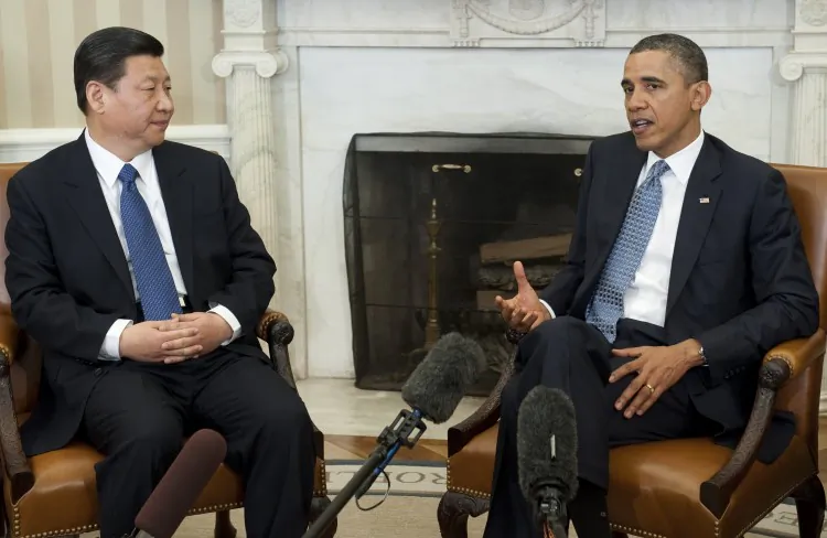 US President Barack Obama and Chinese Vice President Xi Jinping speak during meetings in the Oval Office of the White House in Washington, DC, Feb. 14, 2012. (Saul Loeb/AFP/Getty Images)
