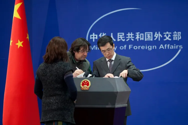 China's Foreign Ministry spokesperson Liu Weimin (R) . (Ed Jones/AFP/Getty Images)