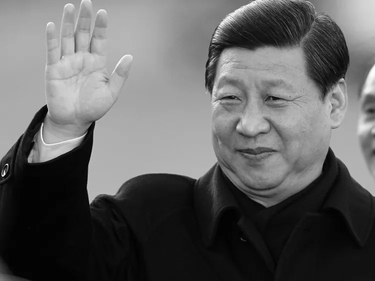 Xi Jinping waves to the media upon his arrival at Shannon airport, in Ireland, on Feb. 18, 2012. (Peter Muhly/AFP/Getty Images)