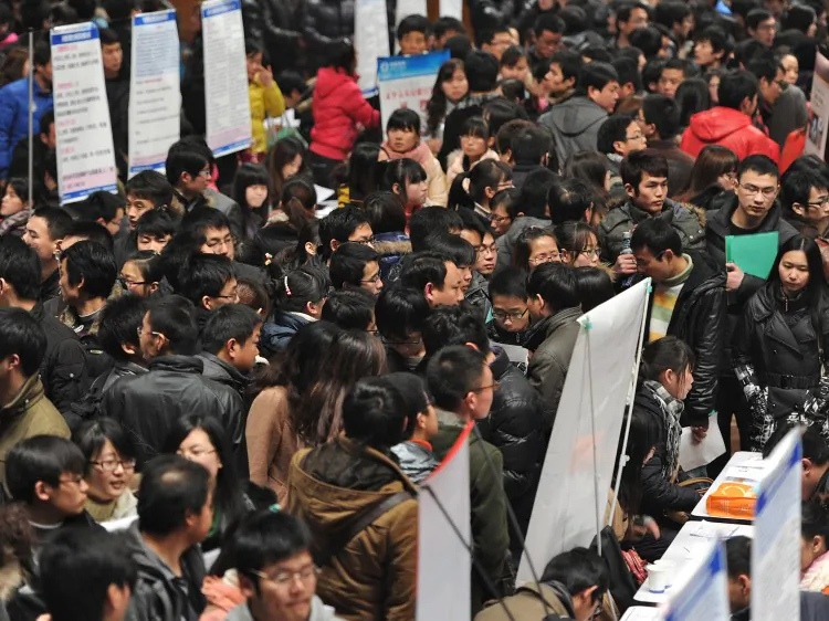 Thousands of job seekers flock to an employment fair in Hefei, east China's Anhui Province on Feb. 25, 2015. (STR/AFP/Getty Images)