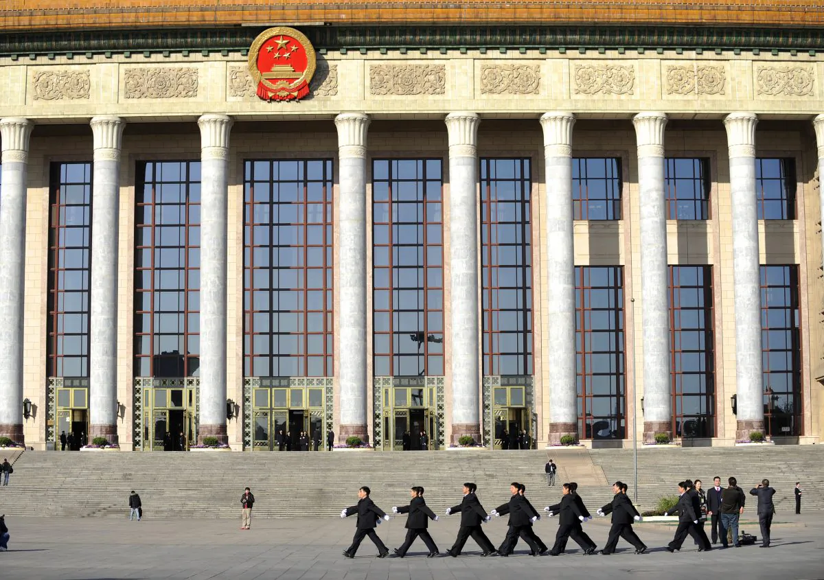 A squad of security personnel march during the National People's Congress in front of the Great Hall of the People in Beijing on Mar. 9, 2011. (Liu Jin/AFP/Getty Images)
