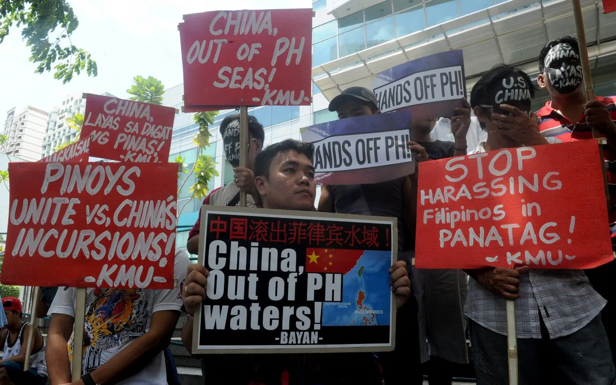 Protesters hold a rally in front of the Chinese Consulate in Manila's financial district on July 7, denouncing the Chinese regime's claims to the South China Sea. Chinese authorities may soon start the second phase of island building in the disputed waters. (Jay Directo/AFP/Getty Images)