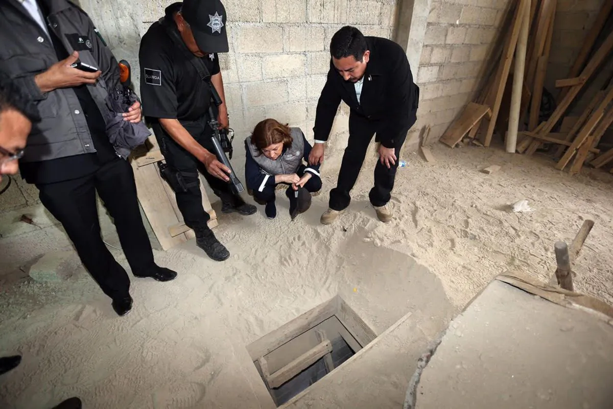 Mexico's attorney general authorities inspect the exit of the tunnel they claim was used by drug lord Joaquin "El Chapo" Guzman to break out of the Altiplano maximum security prison in Almoloya, west of Mexico City, on July 12, 2015. (Mexico's Attorney General's Office via AP)