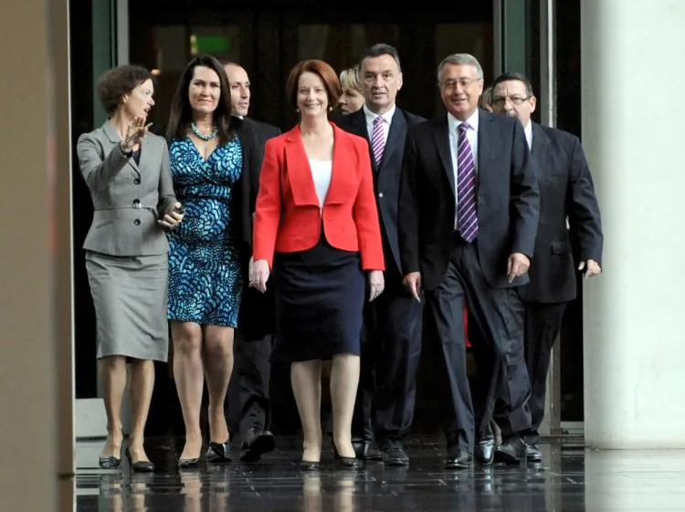Australian Prime Minister Julia Gillard arrives with supporters for the caucus meeting on Feb 27 in Canberra, Australia. Prime Minister Gillard received 71 votes to Kevin Rudd’s 31 in the leadership ballot today, securing her position as Australian Labor Party leader and prime minister. (Alan Porritt-Pool/Getty Images)