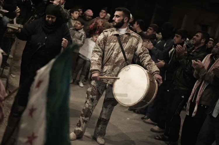 Syrian anti-regime protesters take part in a demonstration in Qusayr, nine miles from Homs, on February 27, 2012. (Gianluigi Guercia/AFP/Getty Images)