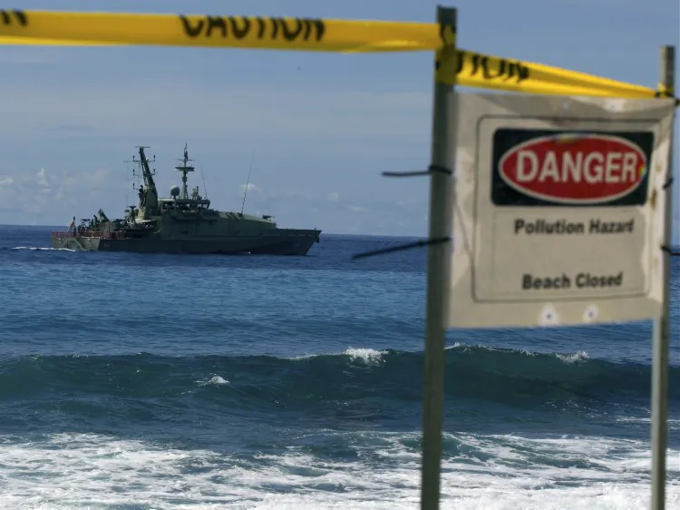 An Australian navy boat cruises by Christmas Island on Feb. 29. A boatload of asylum seekers from China decided to seek refugee status in Australia rather than attempt the dangerous journey onto New Zealand. (Paula Bronstein/Getty Images)