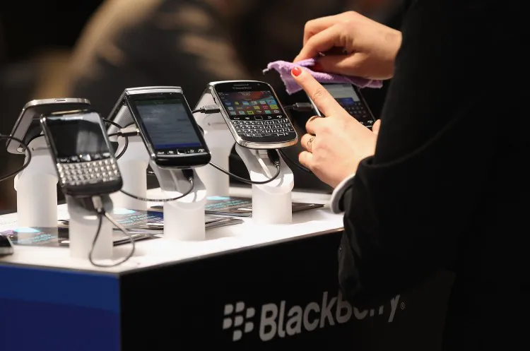 Visitors try out Blackberry smartphones at the Blackberry stand on the first day of the CeBIT 2012 technology trade fair on March 6, 2012 in Hanover, Germany. (Sean Gallup/Getty Images)
