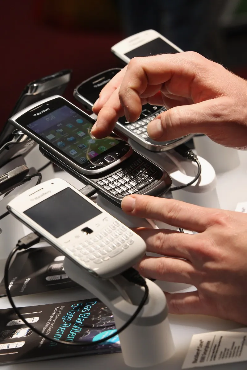 Visitors try out BlackBerry smartphones at the Blackberry stand at the CeBIT 2012 technology trade fair on March 6 in Hanover, Germany. BlackBerry maker Research In Motion last week reported weaker-than-expected quarterly earnings. (Sean Gallup/Getty Images)