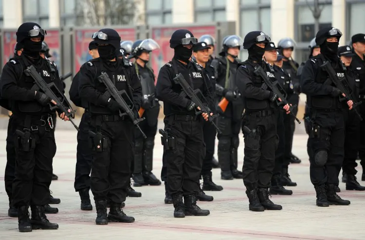 A squad of Chinese special police gather during a demonstration of their skills in Hefei, east China’s Anhui province on March 11. China will spend US$111.6 billion on its police forces in 2012, the regime said as it focuses on quelling rising social unrest ahead of a 10-yearly leadership change. (STR/AFP/Getty Images)