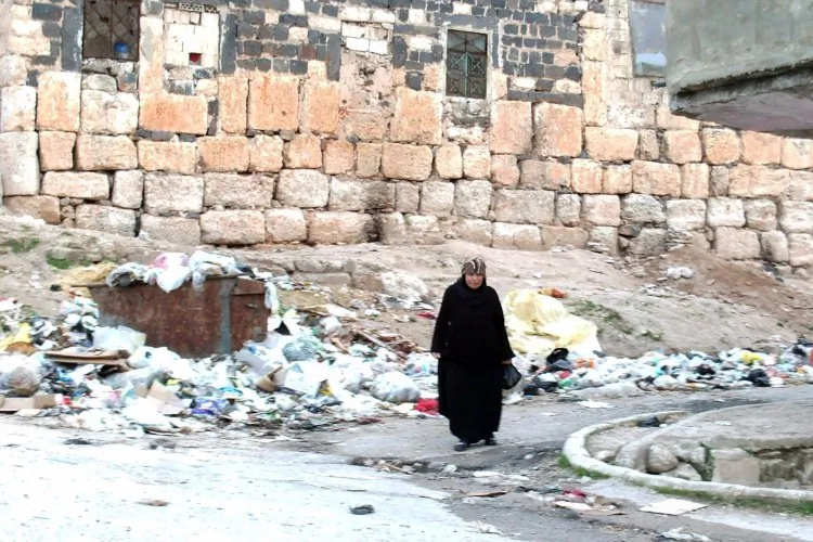 A Syrian woman walks along a street in the town of Rastan, located near Homs, on March 11, 2012. (AFP/Getty Images)