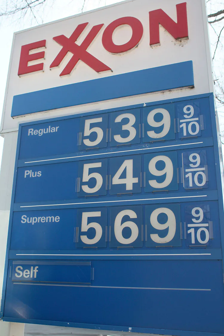 A sign shows gas prices over $5.00 a gallon for all three grades at an Exxon service station on March 13 in Washington, D.C. So far in 2012, U.S. car and light trucks sales improved over sales during the same period in 2011, but large car sales decreased by 87.3 percent and large SUVs by 7.8 percent. (Mark Wilson/Getty Images)