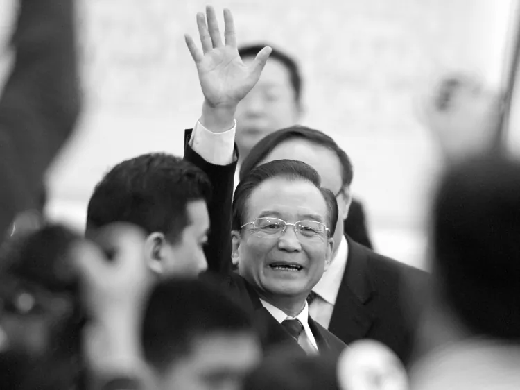 Chinese Premier Wen Jiabao waves to media as leaves after a press conference of the National People's Congress's (NPC) annual session on March 14, 2012. (Liu Jin/AFP/Getty Images)