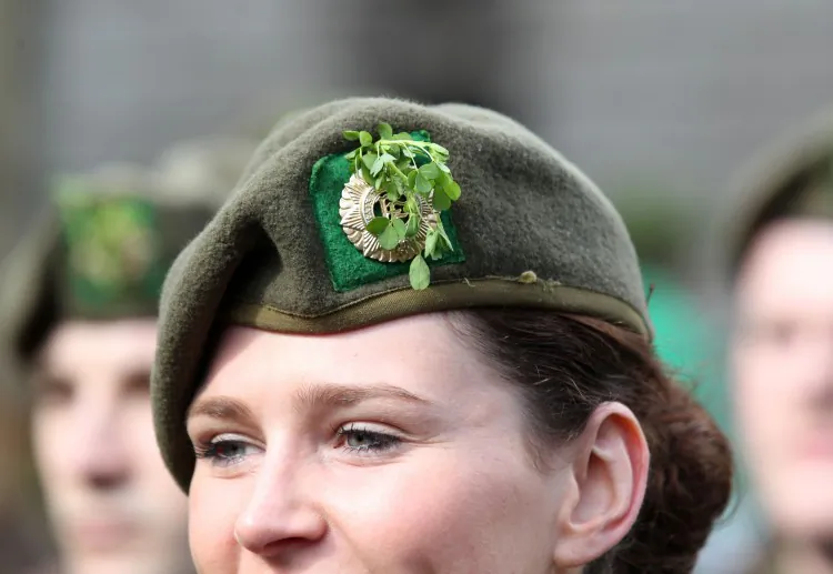 Picture of an Irish female army officer wearing a shamrock in her cap as she marches in the St Patrick's Day festivities in Dublin, Ireland on March 17, 2012. (PETER MUHLY/AFP/Getty Images)