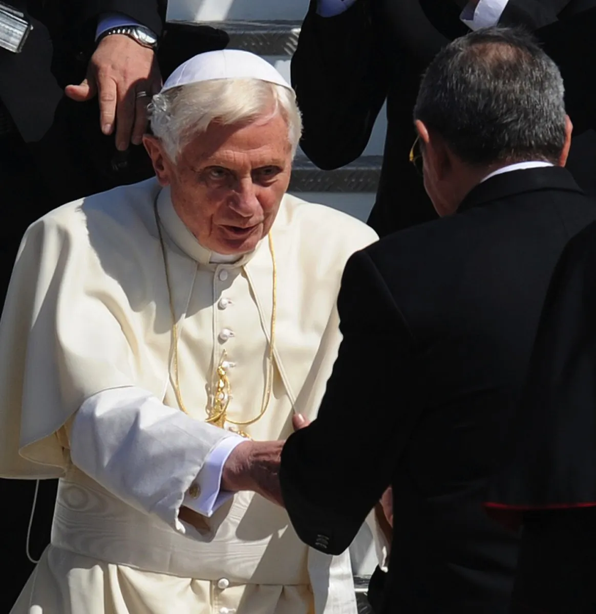 Pope Benedict XVI (L) is welcomed by Cuban President Raul Castro (R) upon arrival to Antonio Maceo airport, in Santiago de Cuba, on March 26. (Rodrigo Arangua/AFP/Getty Images)