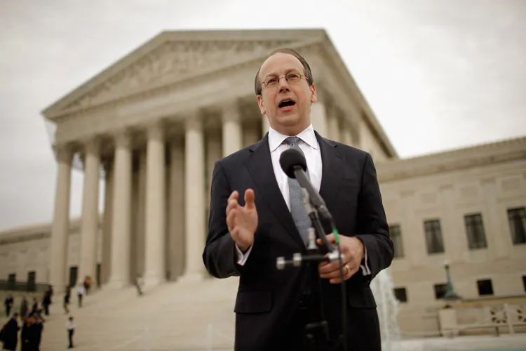 Paul Clement, the attorney representing the 26 states challenging the Patient Protection and Affordable Care Act, talks to the news media outside the U.S. Supreme Court on the third day of oral arguments over the constitutionality of the act. (Somodevilla/Getty Images)