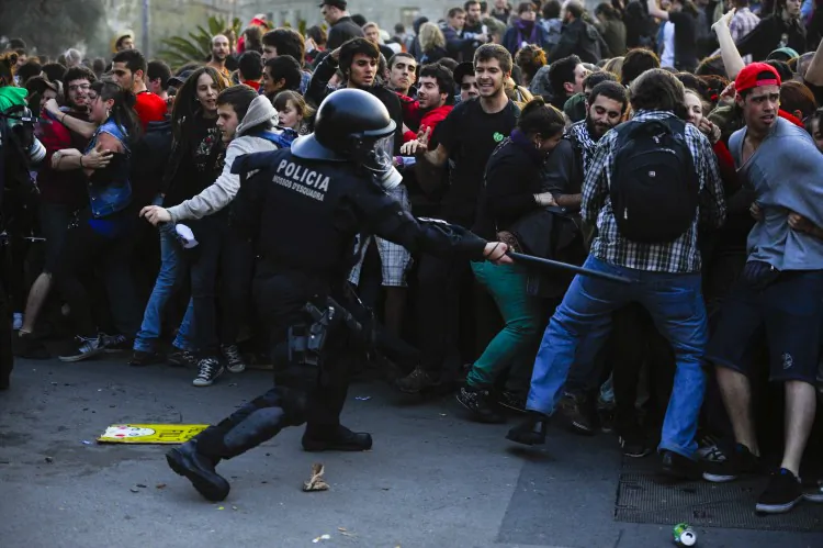 Riot police clash with demonstrators during heavy clashes with demonstrators during a 24-hour strike on March 29, 2012 in Barcelona, Spain. (David Ramos/Getty Images)
