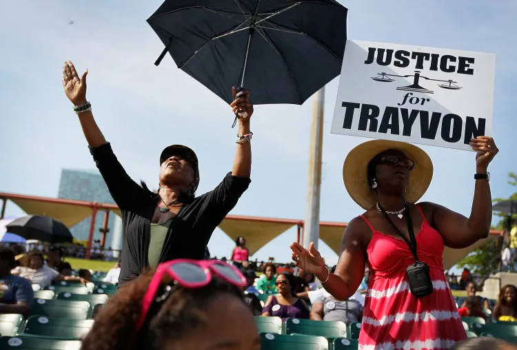 Trayvon Martin supporters gather for a rally in his honor at the Bayfront Amphitheater on April 1, in Miami, Florida. Martin was killed by George Michael Zimmerman who was on neighborhood watch patrol in the gated community of The Retreat at Twin Lakes, Florida. (Joe Raedle/Getty Images)