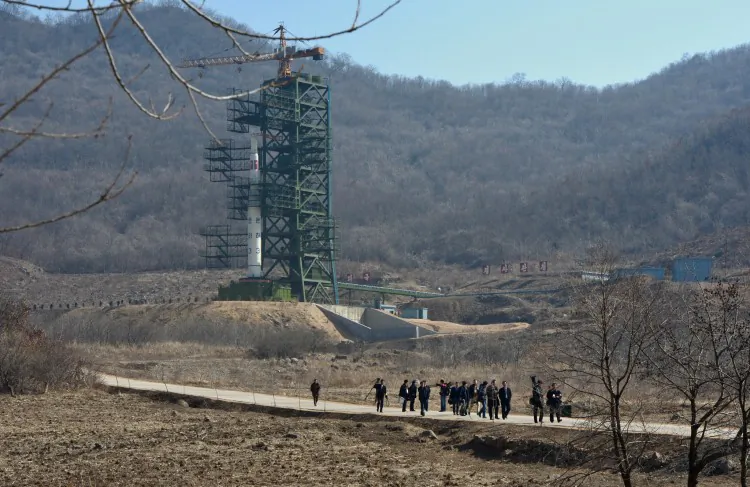 North Korean officials and foreign journalists leave the launch pad after a visit to see the rocket in Tangachai -ri space center on April 8, 2012. North Korea has confirmed their intentions to launch the rocket next week despite international condemnations. (Pedro Ugarte/AFP/Getty Images)