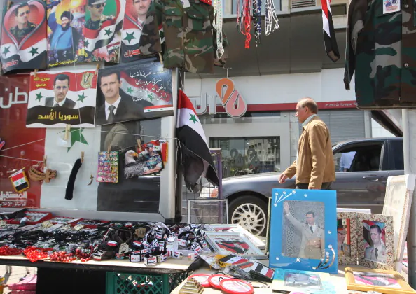 Memorabilia picturing Syrian President Bashar Al-Assad is displayed for sale in Damascus on April 12, 2012, as a UN-backed ceasefire went into effect.(Louai Beshara/AFP/Getty Images)