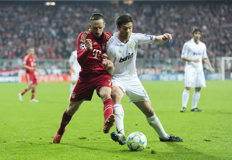 Franck Ribery and Xabi Alonso tangle in a tantalizing Champions League semifinal between Bayern Munich and Real Madrid on Tuesday in Munich. (Javier Soriano/AFP/Getty Images)