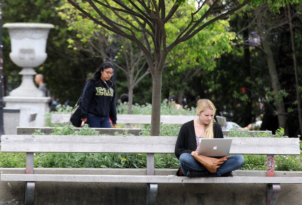 A college student using a laptop on a college campus in California. The proposed Student Right to Know Before You Go Act would put in place federal legislation that would call on colleges and universities to track their graduates data in employment after education. (Justin Sullivan/Getty Images)