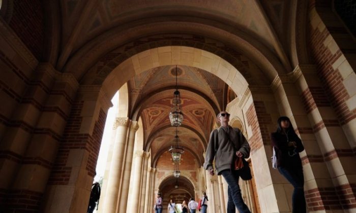 Students walk near Royce Hall on the campus of UCLA in Los Angeles, Calif., April 23, 2012. Student loans have now surpassed credit cards as the largest source of unsecured U.S. consumer debt. (Kevork Djansezian/Getty Images)