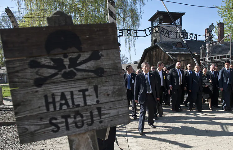 Chinese Premier Wen Jiabao (Third from right) visits the site of the the former Nazi German Auschwitz-Birkenau death camp. When Premier Wen Jiabao chose to give remarks at the site of the Auschwitz concentration camp, he was speaking to the Chinese people, argue the authors of this article. (Pawel Ulatowski/AFP/GettyImages)