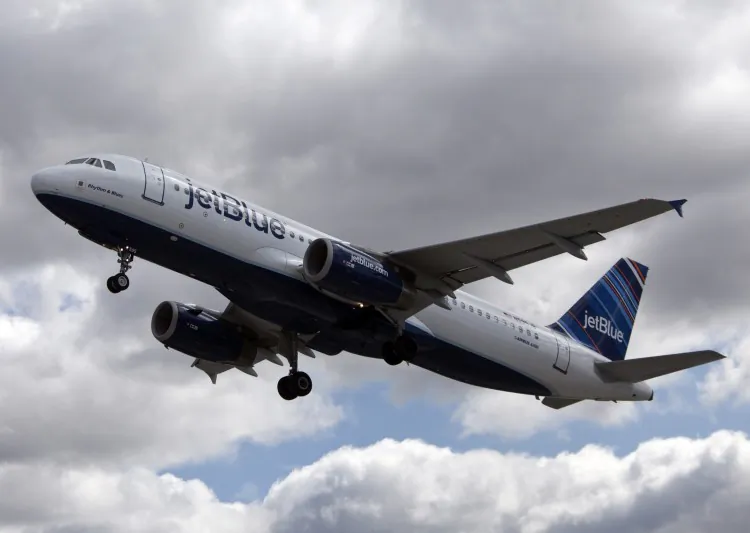 A JetBlue plane at John F. Kennedy International Airport. JetBlue was fined $90,000 for not telling passengers on a delayed flight that they could leave the plane. (Allison Joyce/Getty Images)