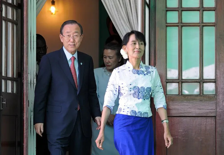 United Nations Secretary General Ban Ki Moon (L) and Burmese opposition leader Aung San Suu Kyi walk out of her residence to address reporters following a meeting in Yangon on May 1. (Soe Than Win/AFP/GettyImages)