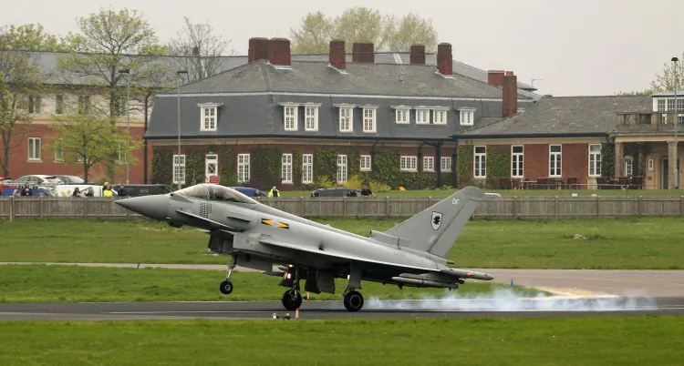 A Royal Air Force Typhoon jet, which will be used to defend the skies over the Olympic Games, lands at the RAF Northolt airbase on May 2 in London. (Oli Scarff/Getty Images)