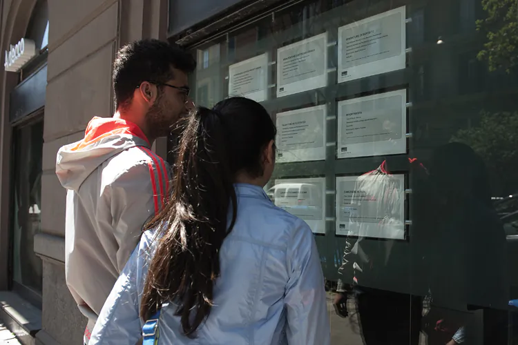 Two people look at job announcements on the window of an agency in Naples on May 3, 2012. Italy's unemployment rate hit a record of 9.8 per cent in March, as a recession in the eurozone's third-biggest economy deepens. (Anna Monaco/AFP/GettyImages)