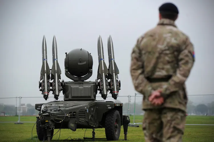 A soldier from the Royal Artillery looks on as a Rapier missile defence system, which could play a role in providing air security during the Olympics, is shown to members of the media at Blackheath in southeast London on May 3, 2012. (Carl Court/AFP/Getty Images)