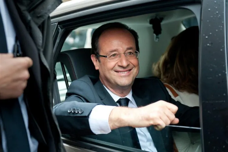 François Hollande is seen leaving a polling station in Tulle, France, after casting his vote in the second round of French Presidential elections on May 6. (Getty Images)