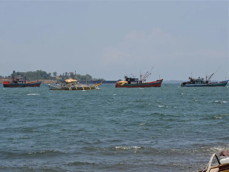 Fishing boats, locally known as 'mother boats' which are used to transport fish caught around Scarborough shoal, north of Manila, facing the South China Sea, on May 10, 2012. For years Filipino and Chinese fishermen peacefully shared the rich harvests around a tiny South China Sea shoal, but today threats, harassment and fear have replaced ocean comradery. (Ted Aljibe/AFP/Getty Images)