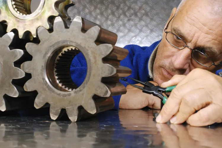 A mechanical engineer contemplates a design solution. Skilled engineers are more in demand in the changing world, especially in the sustainability sector. (Courtesy of the American Society of Mechanical Engineers)