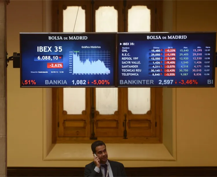 A screen displays the IBEX 35 curve at the Madrid Stock Exchange on May 30. Spanish banks are facing credit rating downgrades after its No. 4 bank Bankia was nationalized. (Pierre-Philippe Marcou/AFP/Getty Images)