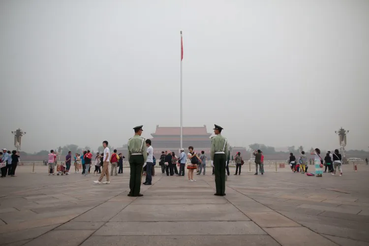 Paramilitary police stand guard on Tiananmen Square in Beijing early on June 3, 2012. (Ed Jones/AFP/Getty Images)