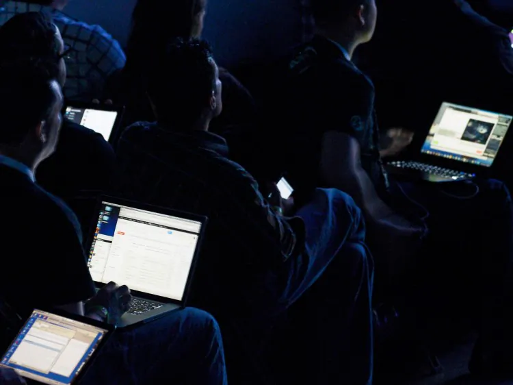 Attendees listen to speakers as they work on their computers during a press conference at the Electronic Entertainment Expo in Los Angeles on June 4, 2012. (Kevork Djansezian/Getty Images)