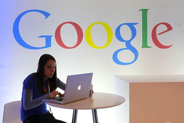 A Google employee works on a laptop before the start of a new conference about Google Maps on June 6, 2012 in San Francisco, California. (Justin Sullivan/Getty Images)