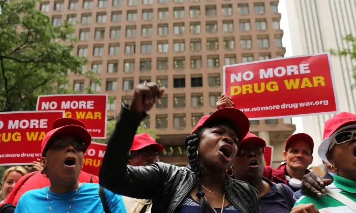 Marijuana legalization advocates and members of community groups attend a rally against marijuana arrests in front of One Police Plaza in New York City in 2012. There are 18 states where adult marijuana use is legal. Voters could make adult use legal in as many as eight more states this fall, (Spencer Platt/Getty Images)