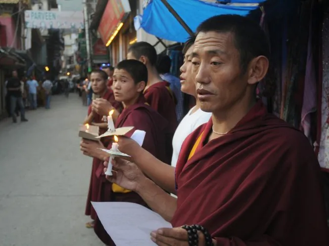 Exiled Tibetans monks chant prayers during a rally to stand in solidarity with monks who self-immolated. In a recent incident, a Tibetan monk protesting in southwestern China was beaten badly by police before being taken away. (STRDEL/AFP/GettyImages)