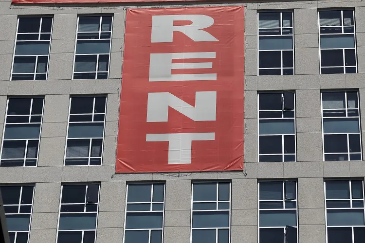 A large “rent” banner is posted on the side of an apartment building in San Francisco on June 15, 2012. Tenant advocates are concerned that a proposed condo conversion ordinance at the Board of Supervisors would reduce the available rental stock in the city. (Justin Sullivan/Getty Images)