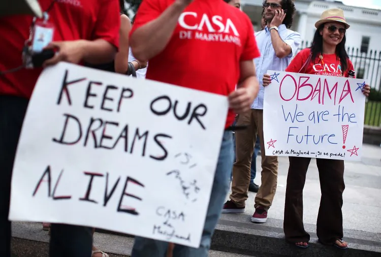 Members of CASA de Maryland celebrate President Barack Obama's announcement about deportation of illegal immigrants on June 15 at the White House. On Aug. 15, the government begins to take applications for deferred action. (Alex Wong/Getty Images)